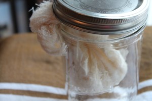 Yogurt draining in a jar